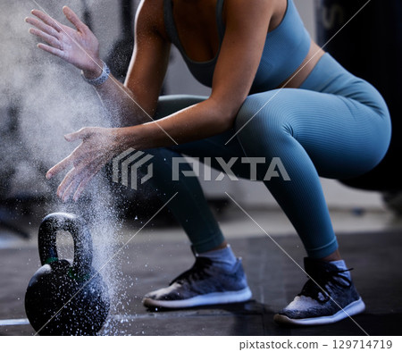 Woman, powder hands and kettlebell exercise, challenge and workout in gym, fitness club and body muscle. Zoom of bodybuilder, chalk and weightlifting, grip and weight training, performance and power 129714719