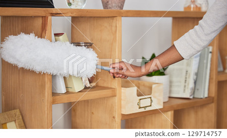 Cleaner woman, duster and home with shelf, wood or display to remove dust, dirt or clean living room. Cleaning expert, house worker or housekeeping in apartment, room or lounge in hospitality service 129714757