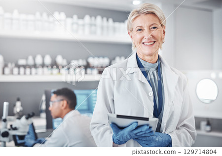 Tablet, portrait or senior scientist in laboratory with a happy smile, growth mindset or goals in medical science. Face, woman or mature doctor with dna health data or genetic research knowledge 129714804