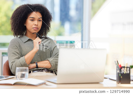 Business laptop, thinking and black woman in office trying to solve problem. Idea, focus and female employee from South Africa with computer contemplating solution, pensive or lost in thoughts alone. Business laptop, thinking and black woman in office trying to solve problem. Idea, focus and female employee from South Africa with computer contemplating solution, pensive or lost in thoughts alone. 129714990