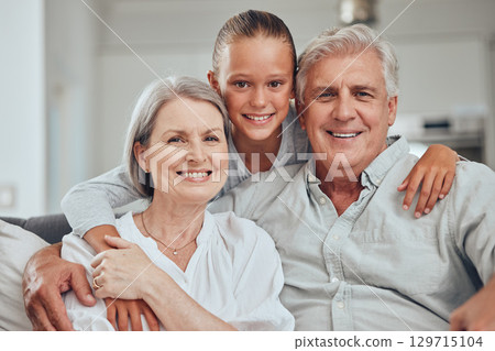 Love, family and portrait by girl and grandparents on sofa for bond, hug and quality time in their home together. Happy family, face and senior man with woman relax with grandchild while babysitting Love, family and portrait by girl and grandparents on sofa for bond, hug and quality time in their home together. Happy family, face and senior man with woman relax with grandchild while babysitting 129715104