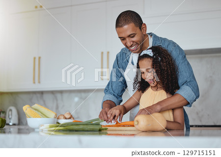 Love, father and girl cooking food with healthy vegetables for lunch or dinner meal as a happy family at home. Nutrition, smile or dad teaching or helping a young child cut carrots on kitchen counter Love, father and girl cooking food with healthy vegetables for lunch or dinner meal as a happy family at home. Nutrition, smile or dad teaching or helping a young child cut carrots on kitchen counter 129715151