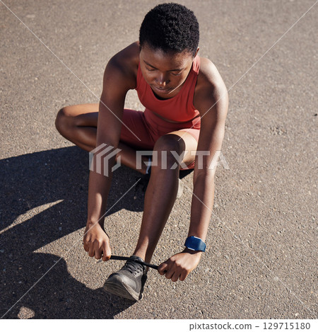 Running, fitness and tie shoes with black woman in road for cardio, workout and training. Sports, ready and performance with girl runner fixing sneakers for jogging, start and stamina endurance 129715180