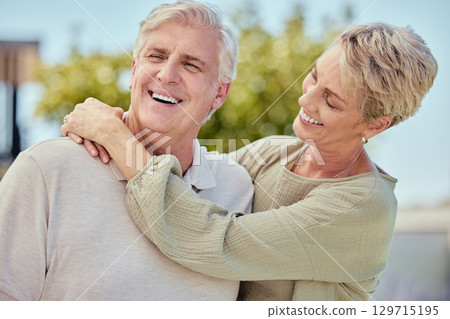 Love, hug and senior couple outdoor on vacation, holiday or summer trip. Relax, romance and freedom of elderly, happy and retired man and woman hugging, embrace or cuddle and enjoying time together. 129715195