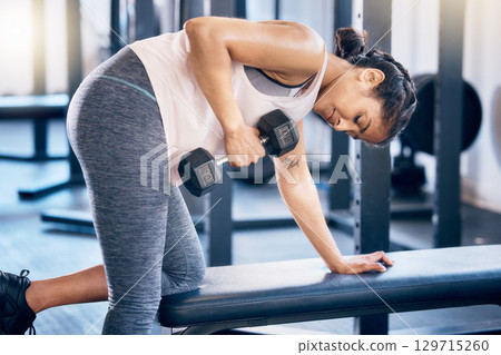 Fitness, dumbbell and training with woman at gym for weightlifting, health and sports workout. Energy, challenge and performance with girl bodybuilder lifting weights for strong muscle Fitness, dumbbell and training with woman at gym for weightlifting, health and sports workout. Energy, challenge and performance with girl bodybuilder lifting weights for strong muscle 129715260