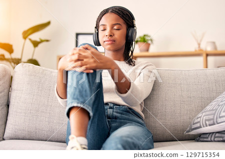 Music headphones, peace and relax girl listening to wellness podcast for calm mindset, mindfulness or audio meditation. Easy meditating, living room sofa or gen z black woman streaming zen radio song 129715354