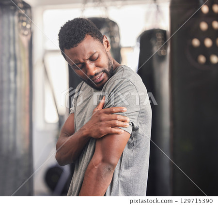 Arm pain, man and fitness injury at gym for training, exercise and morning cardio session. Shoulder ache, guy and muscle mistake after health, body and physical workout with arthritis or inflammation 129715390