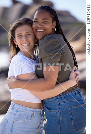 Portrait, women and friends hug with smile, vacation and weekend break. Females, girls and embrace for reunion, happiness and casual outdoor, cheerful and peace on holiday, trip and bonding together. Portrait, women and friends hug with smile, vacation and weekend break. Females, girls and embrace for reunion, happiness and casual outdoor, cheerful and peace on holiday, trip and bonding together. 129715418