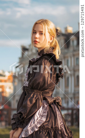 A stunning portrait of a young woman in a historical or gothic-inspired dress with ruffled details and a bow at the back, set against blurred urban background, creating vintage and romantic aesthetic 129715491