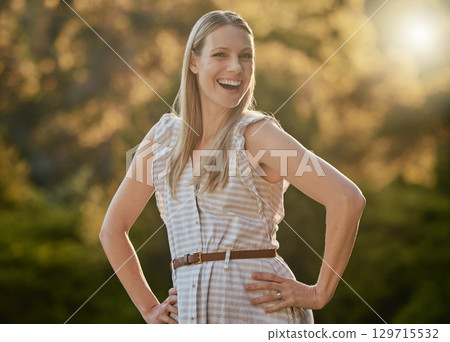 Portrait, happy and woman relax in park, smile and cheerful while walking in nature, fresh air and joy. Face, girl and adventure in forest, excited and having fun, pose and laugh on bokeh background 129715532