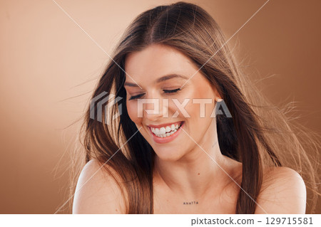 Woman, laughing face or skincare glow on studio background in self love, dermatology treatment or keratine hair style. Smile, happy or brunette beauty model in facial healthcare, wellness or collagen Woman, laughing face or skincare glow on studio background in self love, dermatology treatment or keratine hair style. Smile, happy or brunette beauty model in facial healthcare, wellness or collagen 129715581