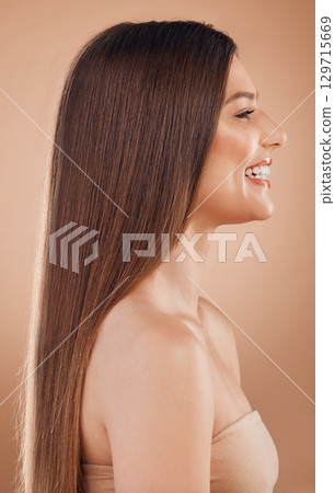 Woman, beauty salon and hair on studio background with healthy shine, glow and keratin aesthetic, skincare or brown color. Girl model, face profile and hair care cosmetics, shampoo product and growth Woman, beauty salon and hair on studio background with healthy shine, glow and keratin aesthetic, skincare or brown color. Girl model, face profile and hair care cosmetics, shampoo product and growth 129715669
