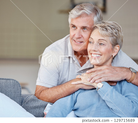 Relax, love and happy with old couple on sofa for peace, marriage and affectionate together. Retirement, bonding and embracing with man and woman in living room of home for happiness, lounge and hug 129715689