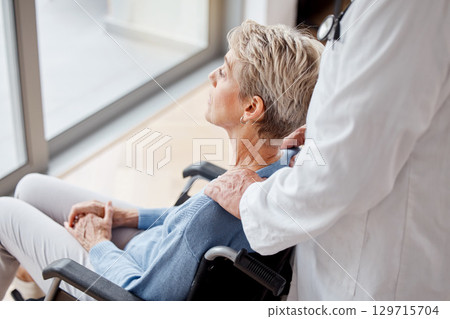 Senior woman, wheelchair and window with nurse, nursing home and support for healthcare, rehabilitation or relax. Old woman, caregiver and disability in retirement home, elderly or sitting in Florida 129715704