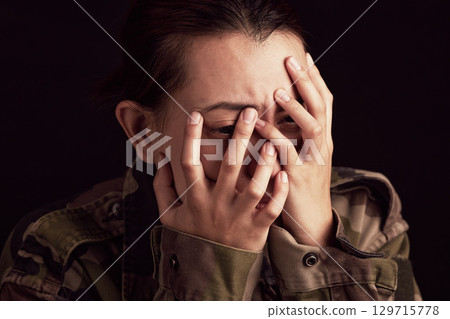 Military woman, mental health and crying in studio for depressed, anxiety and stress in war clothes. Female soldier, sad ptsd or trauma memory from army by black background with depression in Ukraine Military woman, mental health and crying in studio for depressed, anxiety and stress in war clothes. Female soldier, sad ptsd or trauma memory from army by black background with depression in Ukraine 129715778