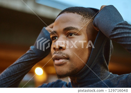 Fitness, black man and hoodie in city running, exercise and workout for motivation, strong mindset and energy of healthy goals. Thinking, runner and sports athlete with focus to start cardio training Fitness, black man and hoodie in city running, exercise and workout for motivation, strong mindset and energy of healthy goals. Thinking, runner and sports athlete with focus to start cardio training 129716048