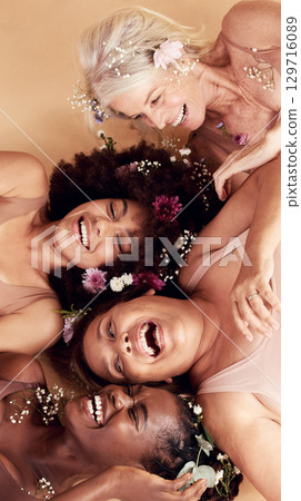 Top view, diversity and women with flowers, cosmetics and skincare on a brown studio background. Multiracial, females and ladies with body positivity, natural beauty or makeup for confidence or smile Top view, diversity and women with flowers, cosmetics and skincare on a brown studio background. Multiracial, females and ladies with body positivity, natural beauty or makeup for confidence or smile 129716089
