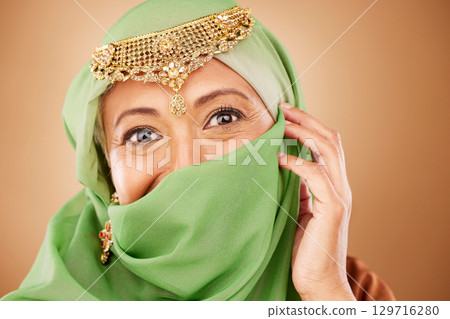 Muslim woman, face or fashion burka on studio background or traditional jewelry, natural makeup cosmetics or religion jewellery. Zoom portrait, happy or mature Islamic model in Dubai aesthetic pride 129716280