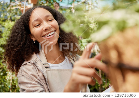 Plant shopping, happy and woman with a decision on flowers, retail garden and store for gardening product. Happiness, choice and business owner with inspection of ecology at a nursery or shop 129716300