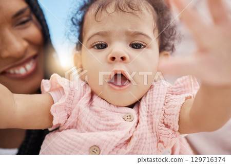 Face, baby or mom bonding in nature park, garden or backyard environment on mothers day, birthday celebration or Brazilian holiday fun. Zoom, toddler portrait or girl and parent in selfie pov or love Face, baby or mom bonding in nature park, garden or backyard environment on mothers day, birthday celebration or Brazilian holiday fun. Zoom, toddler portrait or girl and parent in selfie pov or love 129716374