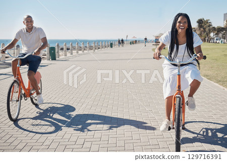 Travel, summer and couple on bike at beach for date on promenade in Chicago, USA sunshine with smile. Freedom, fun and happy black people at ocean with bicycle for wellness, bonding and fitness. 129716391