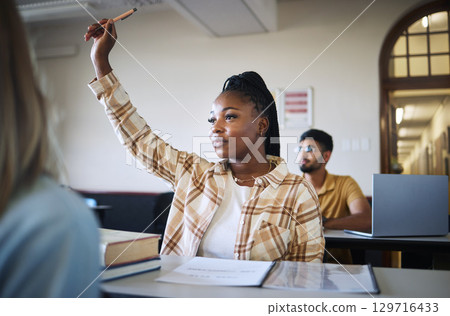 College student, black woman and hands to answer question in classroom for teaching, school education or learning. University student with raised hand for asking questions, studying or campus lecture 129716433