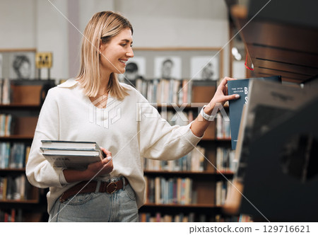 Girl, student and search books in library for education, knowledge and learning. Happy young woman at university, college and bookshelf for reading, studying at campus and doing research for project 129716621