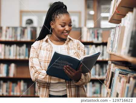 Black woman, library and reading for knowledge, education and relax. Nigerian female, girl and student read book, bookstore and research for task, smile and enjoy free time with literature and study. Black woman, library and reading for knowledge, education and relax. Nigerian female, girl and student read book, bookstore and research for task, smile and enjoy free time with literature and study. 129716622