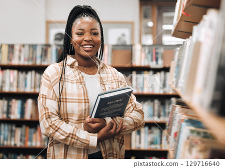 Portrait, black woman and library with book, knowledge and relax with free time. Nigerian female, student smile and customer in bookstore, for reading and literature for education, study and research Portrait, black woman and library with book, knowledge and relax with free time. Nigerian female, student smile and customer in bookstore, for reading and literature for education, study and research 129716640