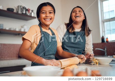 Happy family, mother and girl baking a cake, cookies or muffin in a kitchen laughing at home. Eggs, funny mom and young child holding a rolling pin for flour, wheat or dough learning cooking skills Happy family, mother and girl baking a cake, cookies or muffin in a kitchen laughing at home. Eggs, funny mom and young child holding a rolling pin for flour, wheat or dough learning cooking skills 129716699