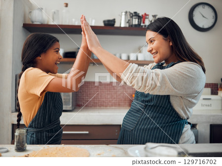 Cooking, high five and success with mother and girl in kitchen for cookies, bonding and pregnancy. Help, happiness and achievement with pregnant woman baking with daughter for support, food and goal 129716702