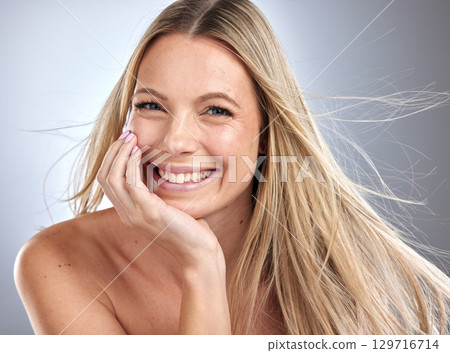 Beauty, wellness and portrait of hair care woman with manicure satisfied with salon treatment. Healthy hair and skincare glow model confident with cosmetic routine on gray studio background. 129716714