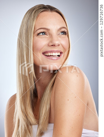 Face, beauty skincare and hair care of woman in studio isolated on a gray background. Makeup, cosmetics and aesthetics of happy female model thinking about salon treatment for hair growth and texture Face, beauty skincare and hair care of woman in studio isolated on a gray background. Makeup, cosmetics and aesthetics of happy female model thinking about salon treatment for hair growth and texture 129716736