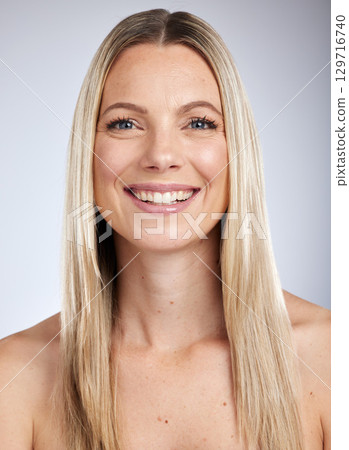 Face portrait, makeup and skincare of woman isolated on a gray studio background. Natural beauty, cosmetics and happy female model from Canada with healthy and glowing skin after facial treatment. Face portrait, makeup and skincare of woman isolated on a gray studio background. Natural beauty, cosmetics and happy female model from Canada with healthy and glowing skin after facial treatment. 129716740