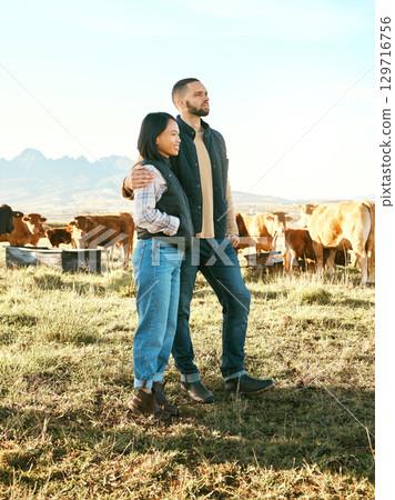 Couple, farm and hug in countryside travel, trip or holiday destination with live stock in natural agriculture. Man holding woman in relationship, traveling or enjoying getaway in nature with animals 129716756