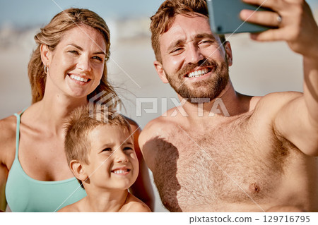 Happy family in selfie at beach with parents and child on holiday, summer vacation and outdoor wellness for social media post. Profile picture update, smartphone with a mother, father and kid on sand Happy family in selfie at beach with parents and child on holiday, summer vacation and outdoor wellness for social media post. Profile picture update, smartphone with a mother, father and kid on sand 129716795