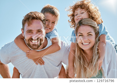 Happy family, portrait and piggy back in summer sunshine, smile and happy for bonding, relax and freedom. Family, happiness and children with mom, dad and love on holiday adventure with sky in Cancun 129716796