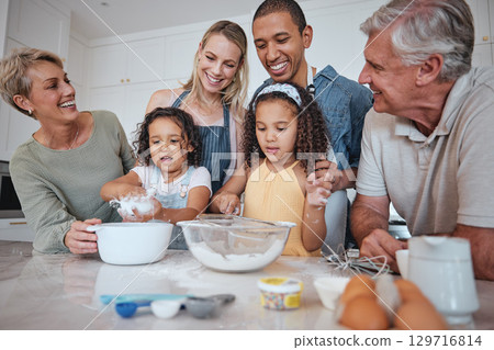 Baking, family and children with their parents and grandparents in the kitchen learning about cooking food. Bake, bonding and love with girl siblings making baked goods in their home together Baking, family and children with their parents and grandparents in the kitchen learning about cooking food. Bake, bonding and love with girl siblings making baked goods in their home together 129716814