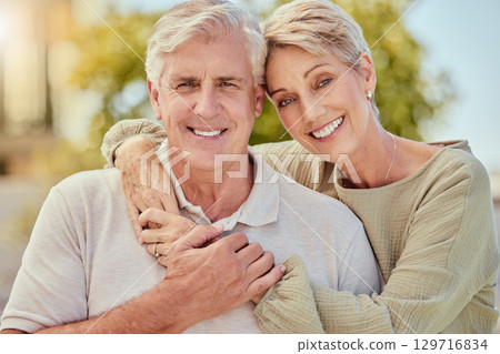 Portrait, love and retirement with a senior couple hugging outdoor in nature together during summer. Happy, smile and park with an elderly man and woman pensioner bonding outside on a romantic date Portrait, love and retirement with a senior couple hugging outdoor in nature together during summer. Happy, smile and park with an elderly man and woman pensioner bonding outside on a romantic date 129716834