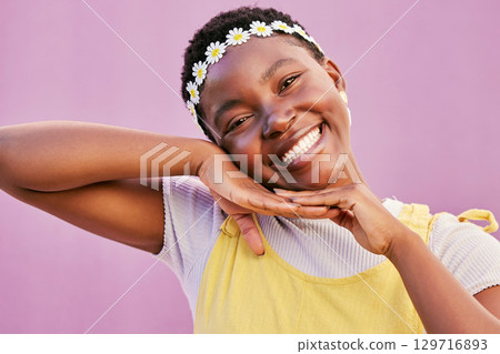 Black woman, happy with fashion and flower crown, spring and style with success and positive mindset with Gen z youth. Trendy, happiness and African girl portrait, smile and pink studio background. 129716893