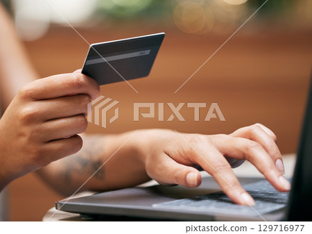 Hands, laptop and credit card with a woman online shopping for a retail sale or deal as a customer. Computer, finance and ecommerce with a female consumer making a payment via the internet Hands, laptop and credit card with a woman online shopping for a retail sale or deal as a customer. Computer, finance and ecommerce with a female consumer making a payment via the internet 129716977