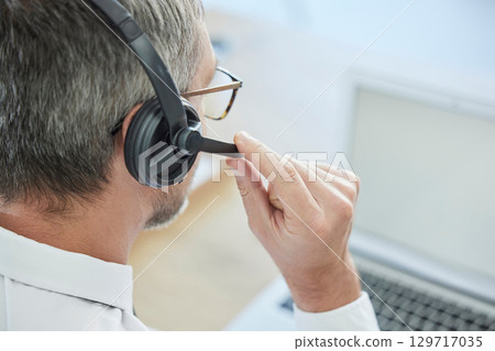 Microphone, call center or man in customer support consulting, helping or speaking of financial loan faq. Crm, contact us or senior salesman in communication, conversation or talking at office desk Microphone, call center or man in customer support consulting, helping or speaking of financial loan faq. Crm, contact us or senior salesman in communication, conversation or talking at office desk 129717035