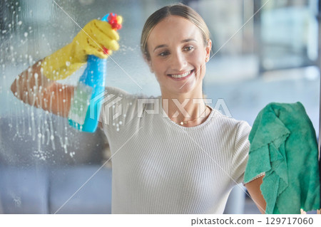 Woman, spring cleaning spray and bottle for windows in house with cloth for dust, bacteria and dirt in room, apartment and home. Happy housekeeping, glass cleaner and maid with chemical detergent 129717060