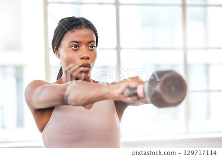 Fitness, breathing and black woman with kettlebell, body builder and weight training in gym, exercise and focus. Athlete, weightlifting and breath with wellness and strong, muscle and workout studio. Fitness, breathing and black woman with kettlebell, body builder and weight training in gym, exercise and focus. Athlete, weightlifting and breath with wellness and strong, muscle and workout studio. 129717114
