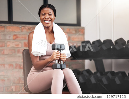 Weights, woman and portrait in the gym for fitness, bodybuilding and training. Strength, bodybuilding and weight lifting with a female for sport, exercise and dumbell activity in a healthclub Weights, woman and portrait in the gym for fitness, bodybuilding and training. Strength, bodybuilding and weight lifting with a female for sport, exercise and dumbell activity in a healthclub 129717123