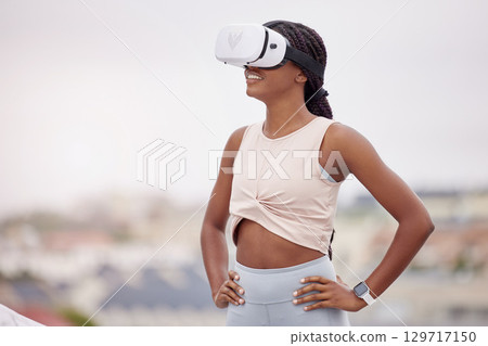 VR fitness, metaverse and black woman training in the city, futuristic workout and digital exercise on a rooftop. 3d health, technology and African athlete with glasses for virtual reality sport 129717150