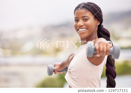 Black woman, smile and dumbbell workout outdoor for fitness training, sports exercise and healthy body lifestyle. Bodybuilder challange, wellness motivation and athlete african woman happy portrait Black woman, smile and dumbbell workout outdoor for fitness training, sports exercise and healthy body lifestyle. Bodybuilder challange, wellness motivation and athlete african woman happy portrait 129717151