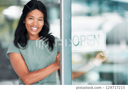 Open sign, black woman and small business owner of restaurant. Welcome, coffee shop and portrait of happy female entrepreneur from Nigeria in startup cafe ready for service while standing at door. 129717215