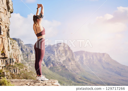Fitness, hiking and woman on mountain stretching, meditation and training in nature for healthy lifestyle. Health, wellness and workout for girl on cliff, yoga exercise on rock for hike in mountains. Fitness, hiking and woman on mountain stretching, meditation and training in nature for healthy lifestyle. Health, wellness and workout for girl on cliff, yoga exercise on rock for hike in mountains. 129717266