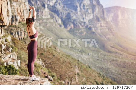 Hiking, stretching and woman in mountains for fitness, summer exercise and training adventure in Portugal. Warm up, sports and girl on a mountain cliff for a walk, workout and wellness in nature Hiking, stretching and woman in mountains for fitness, summer exercise and training adventure in Portugal. Warm up, sports and girl on a mountain cliff for a walk, workout and wellness in nature 129717267